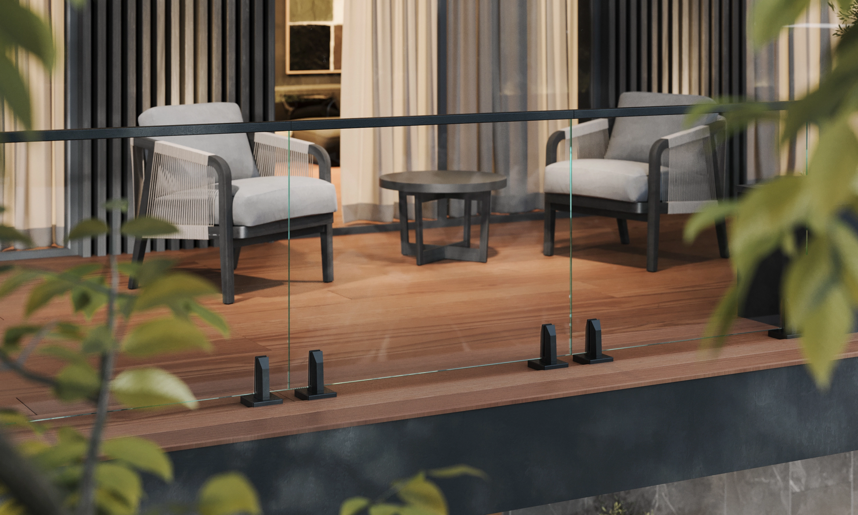 Armchairs and a low table sit beyond glass railing, Talon Spigots at deck level