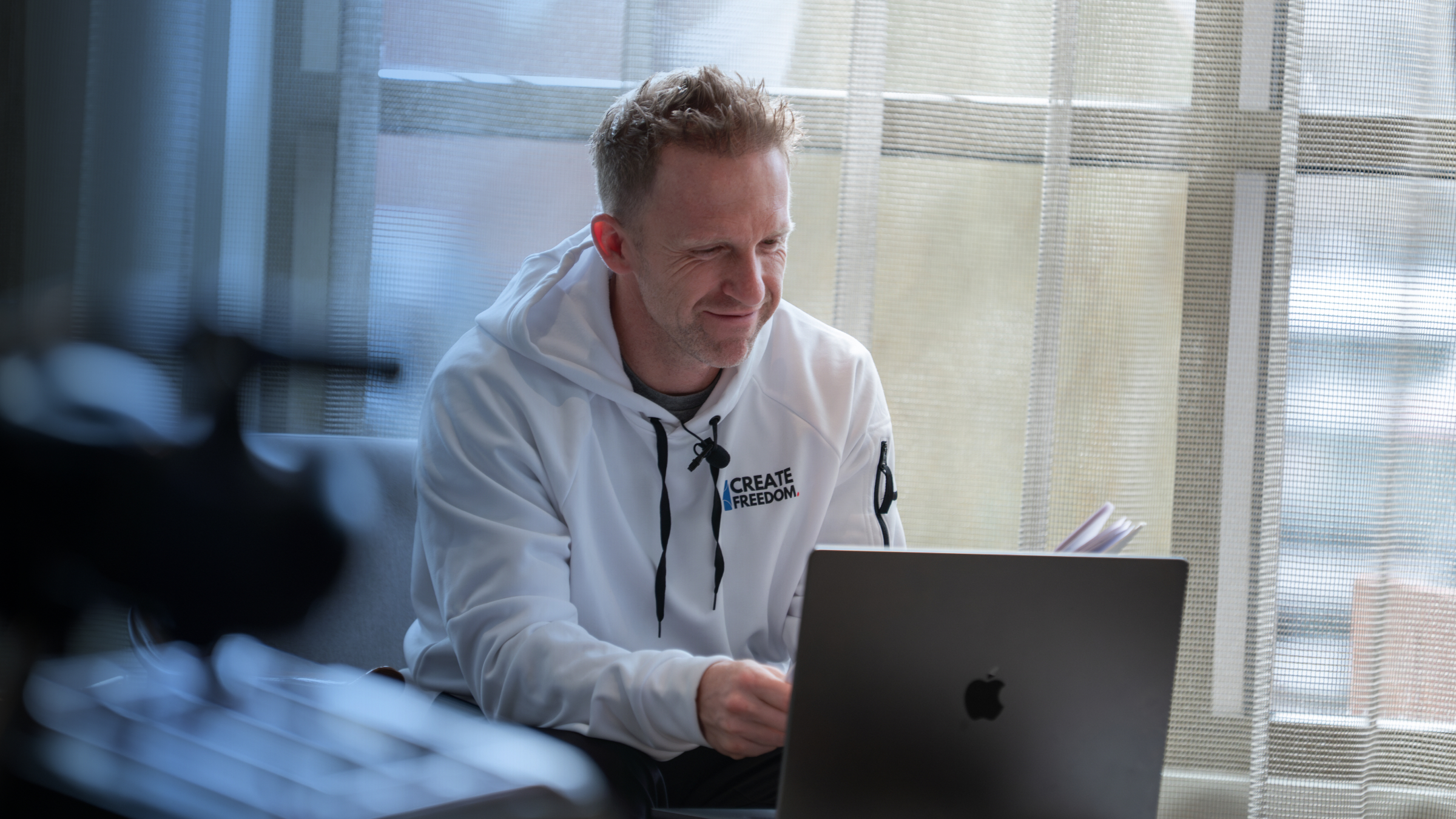 Business owner reviewing ad performance on a laptop