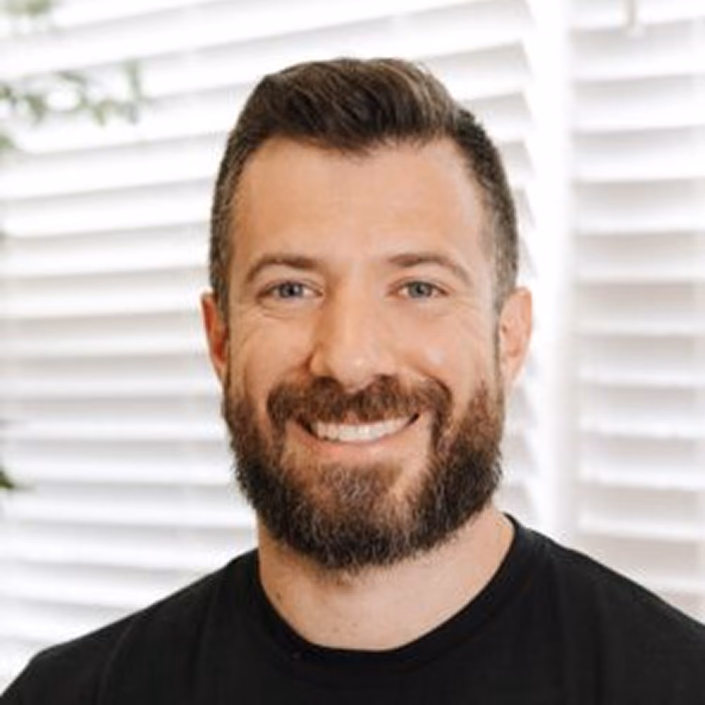 A professional photo of our team member, Justin.