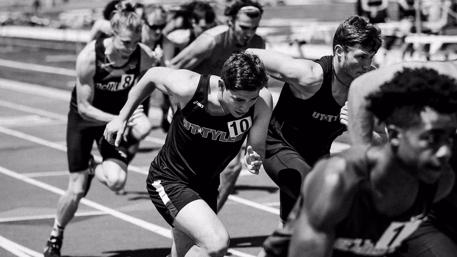 group of runners in black and white