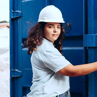 A woman in a white hard hat