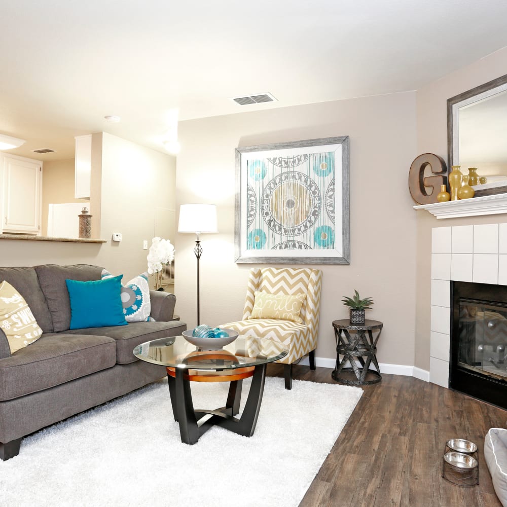Living area with sofa, coffee table and fire place