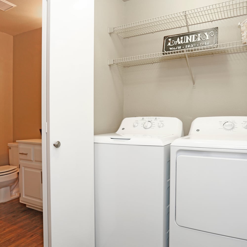 Laundry room with white appliances