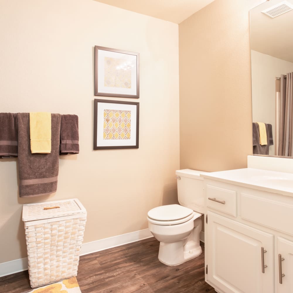 Bathroom with white cabinets and mirror
