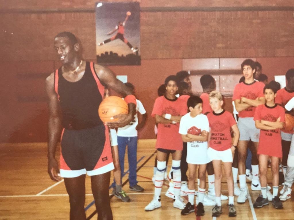 Michael Jordan with young Brixton Topcats players during his visit to the club