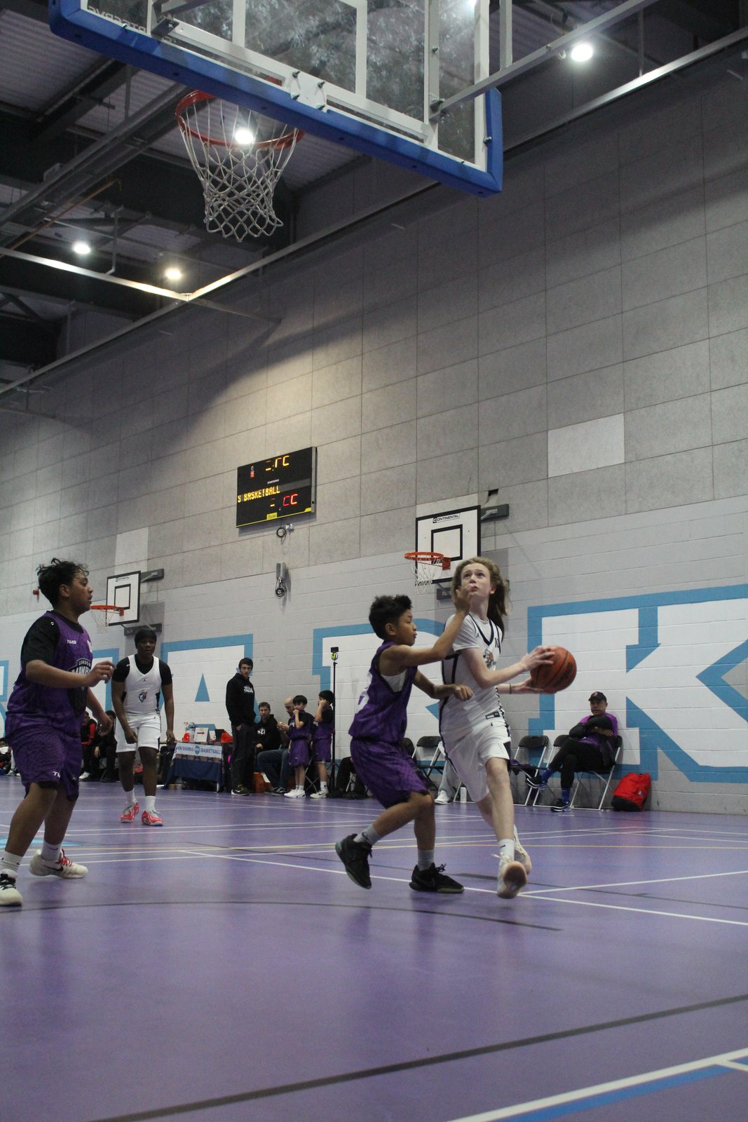 Brixton Topcats Under-13 player shooting over a defender