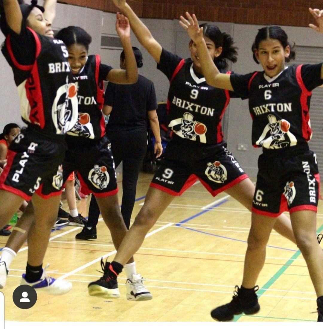 Brixton Topcats girls in black kit in action