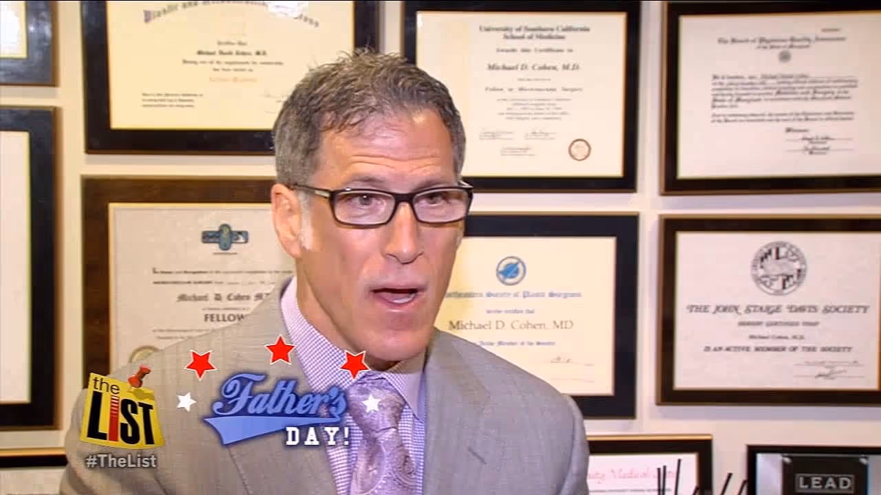 A logo featuring the text 'The List' with the hashtag '#TheList' and three red stars above the words 'Father's Day.' A man in a suit and glasses is speaking in front of framed certificates and awards on the wall.
