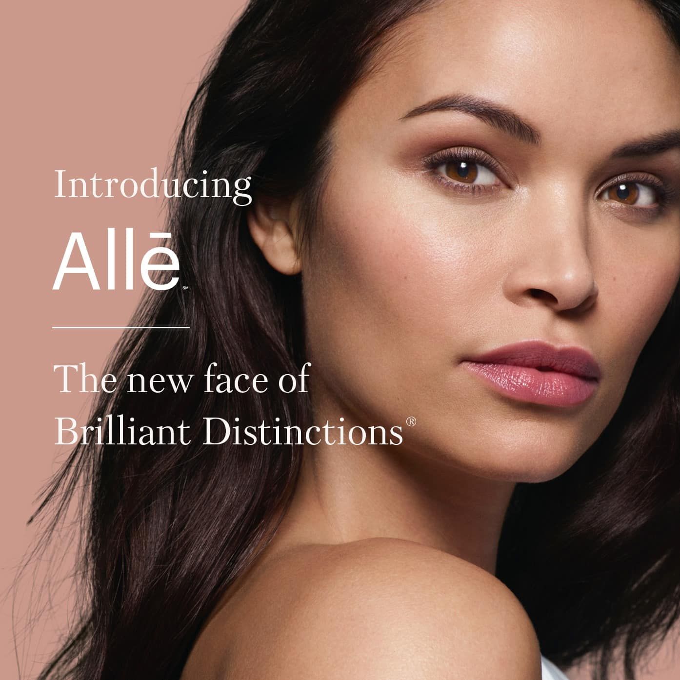 A close-up image of a woman with a natural makeup look, showcasing her smooth skin and features. The text reads 'Introducing Allē' and 'The new face of Brilliant Distinctions®' in a modern font.