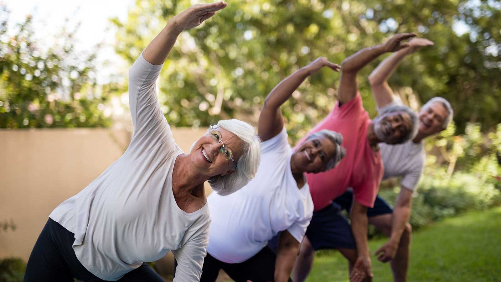 older adults stretching during tai chi practice