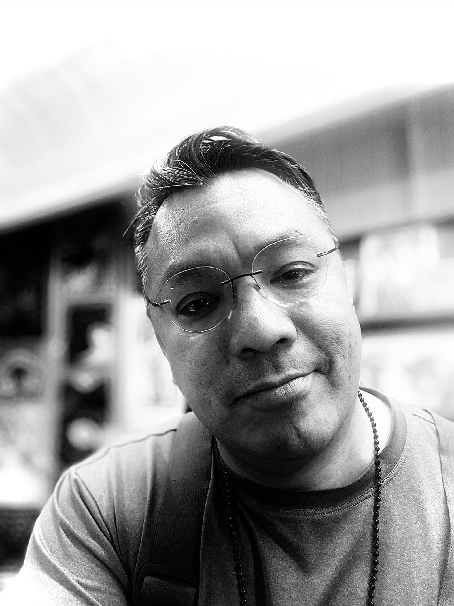 Black and white portrait of a man with glasses