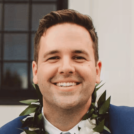 Smiling man wearing a flower lei