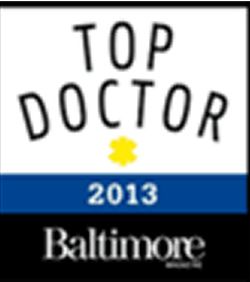 A logo featuring the words 'TOP DOCTOR' in black, with a yellow star icon above it, and the year '2013' below in blue, along with the word 'Baltimore' in white at the bottom.