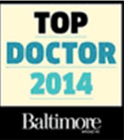 The text 'TOP DOCTOR 2014' in bold black and turquoise lettering, with 'Baltimore' in smaller white font below.