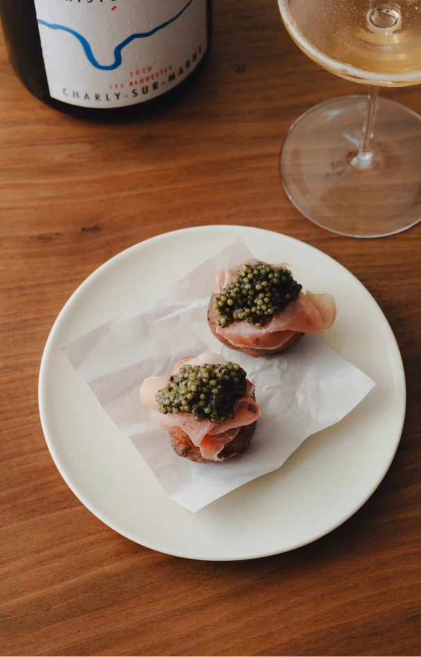 Herb-topped bites served with Champagne Christophe Baron