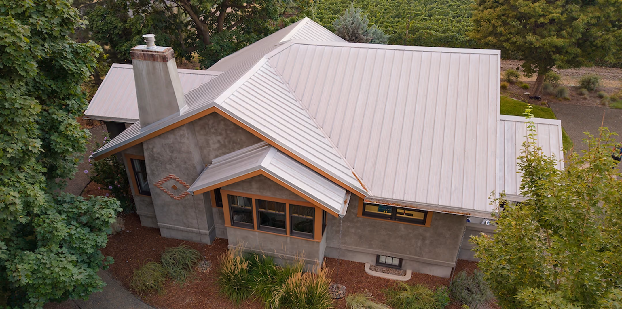 Aerial view of Le Pavillon, a stone cottage among the trees