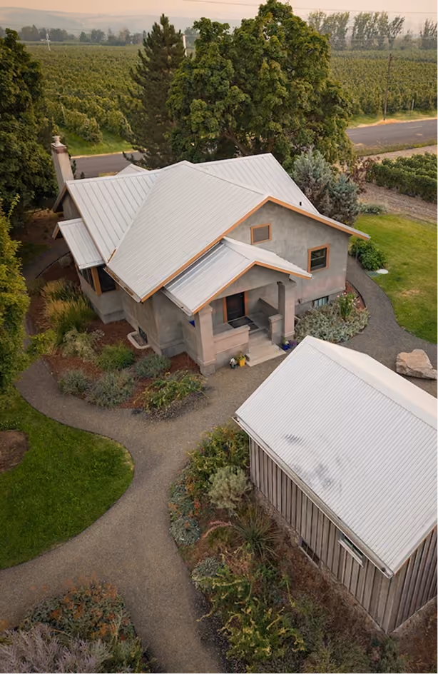 Aerial view of Le Pavillon, a stone cottage among the trees
