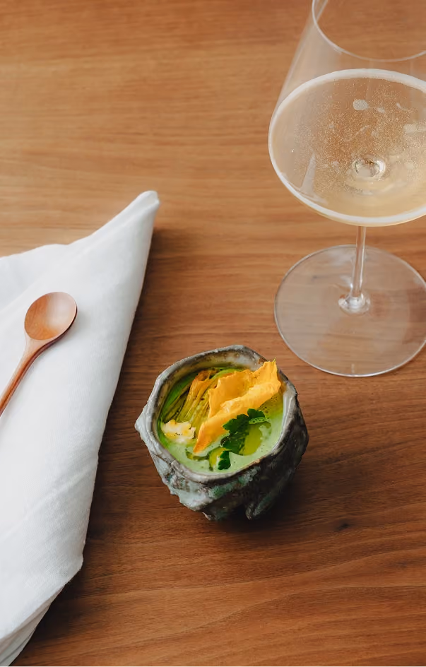 Seasonal vegetable course with a glass of Champagne