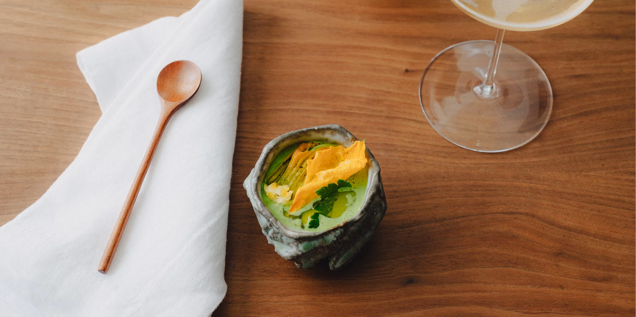 Seasonal vegetable course with a glass of Champagne