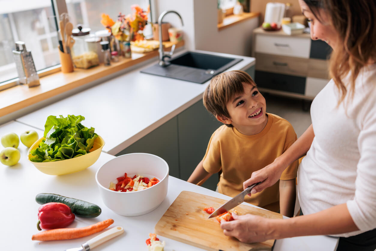 Child exploring foods at the table