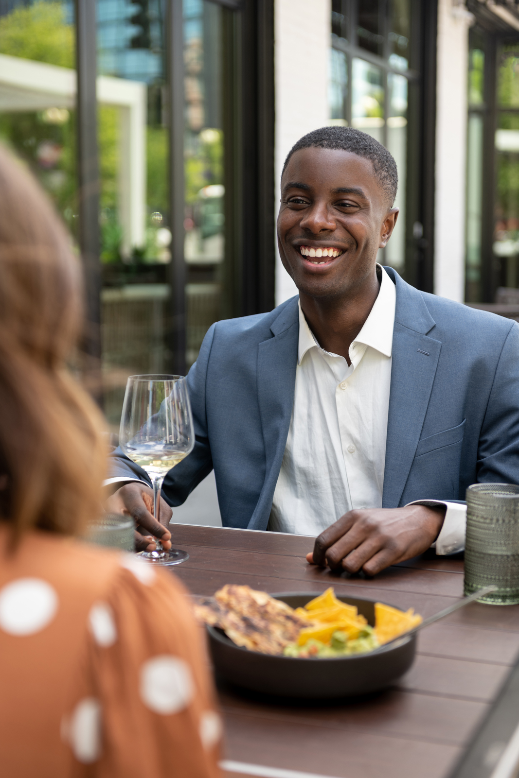 Guests sharing a meal on the dLeña patio