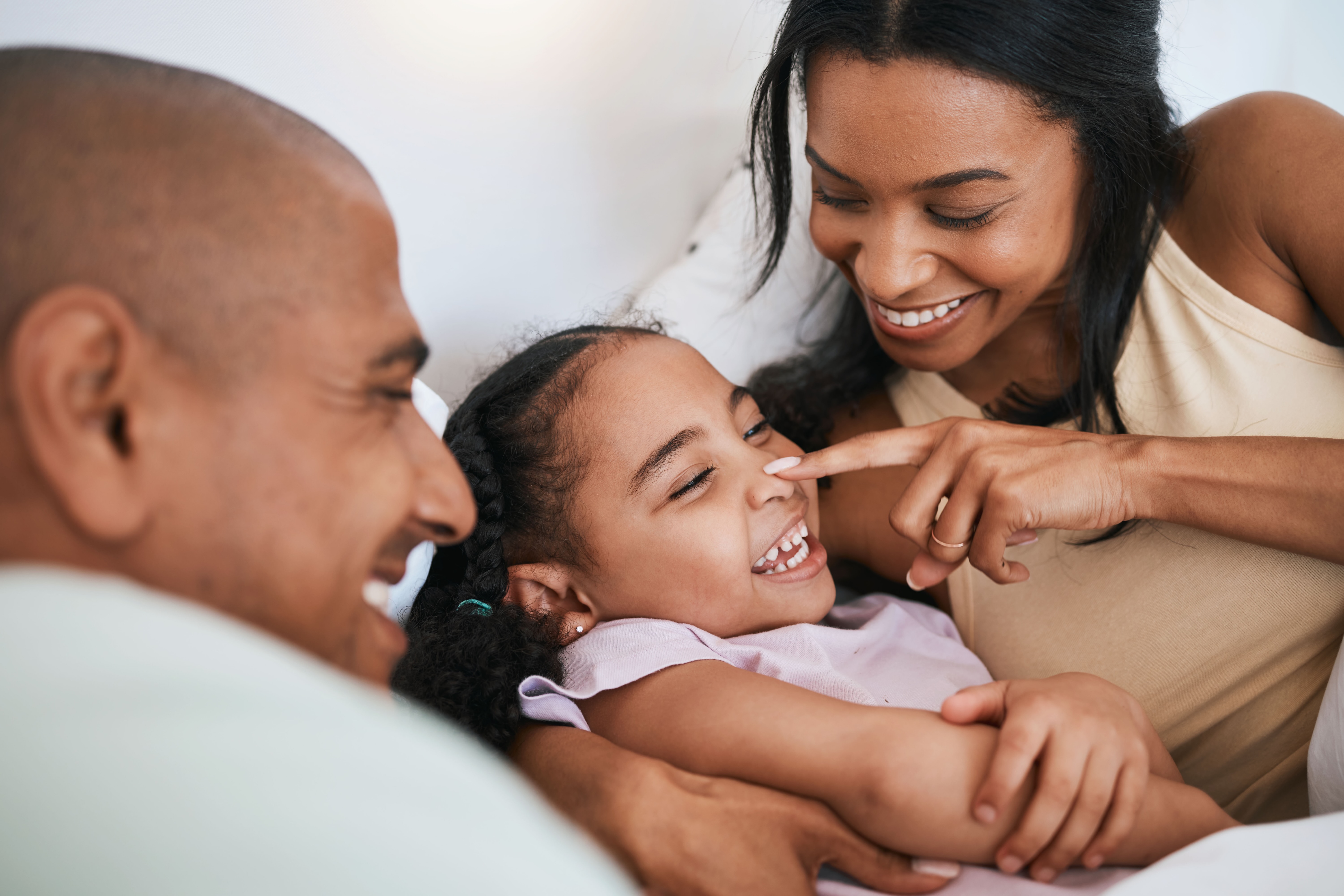Mom dad and child laying together stock image