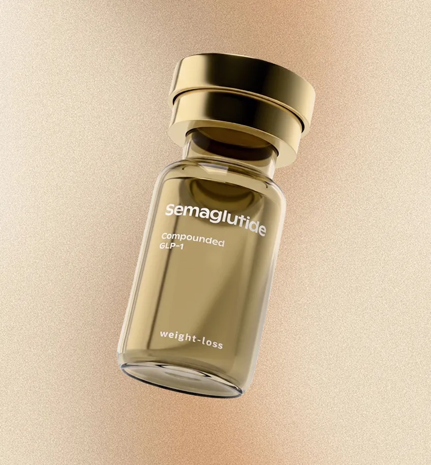 Close-up of a small, transparent vial with a gold cap labeled 'semaglutide compounded GLP-1 weight-loss' against a textured beige background.