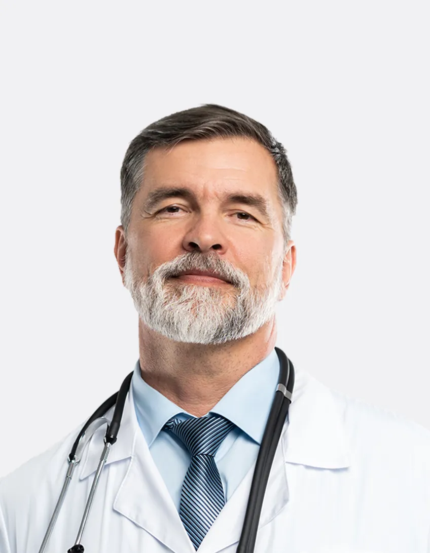 Middle-aged male doctor with gray hair and beard, wearing a white coat, blue shirt, blue striped tie, and a stethoscope around his neck.