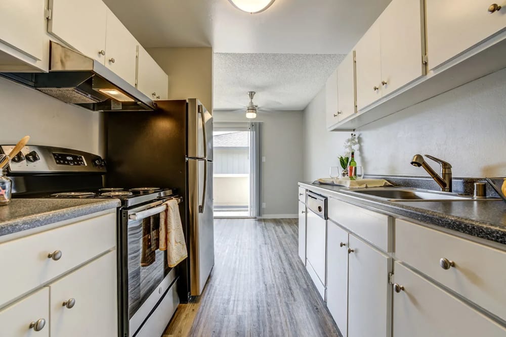 Kitchen with white cabinets and stainless steel appliances