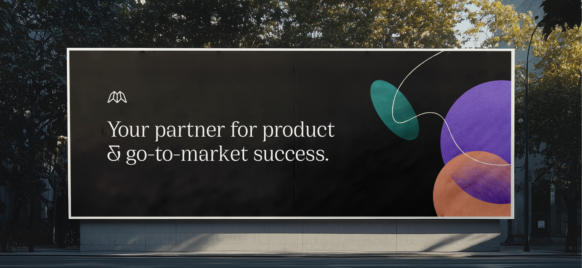 Billboard with text 'Your partner for product & go-to-market success' and abstract colorful shapes.