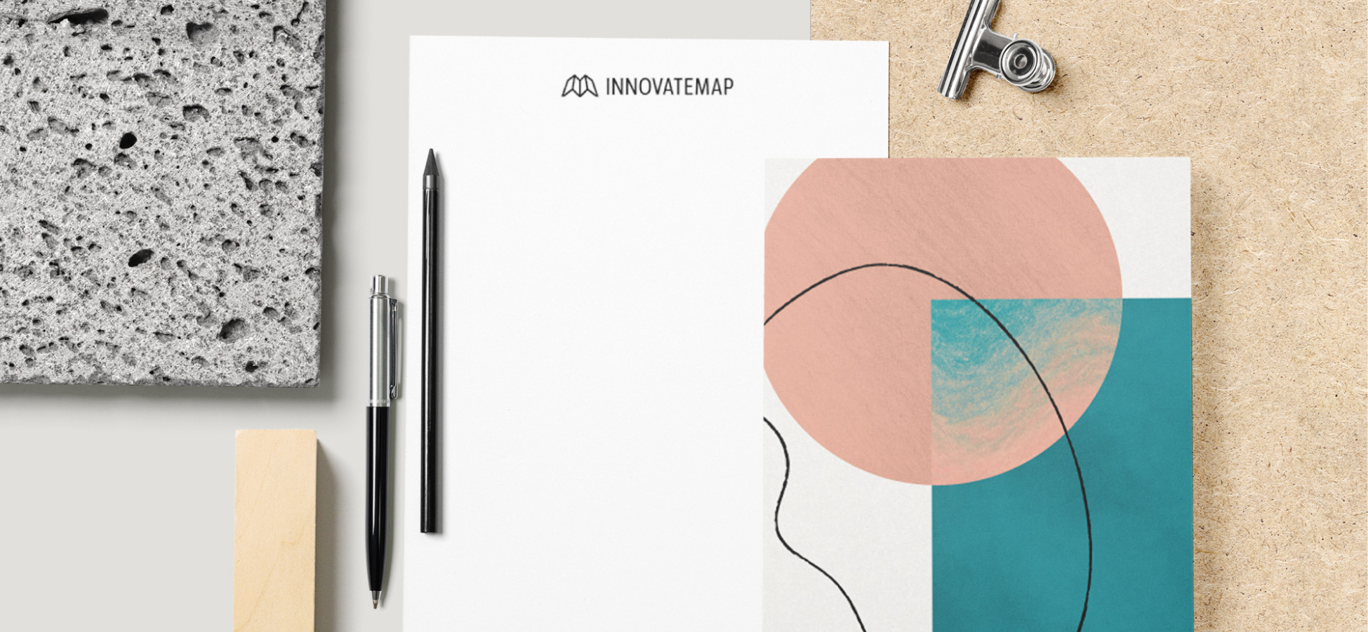 InnovateMap stationery set with pens and abstract design on textured backgrounds.