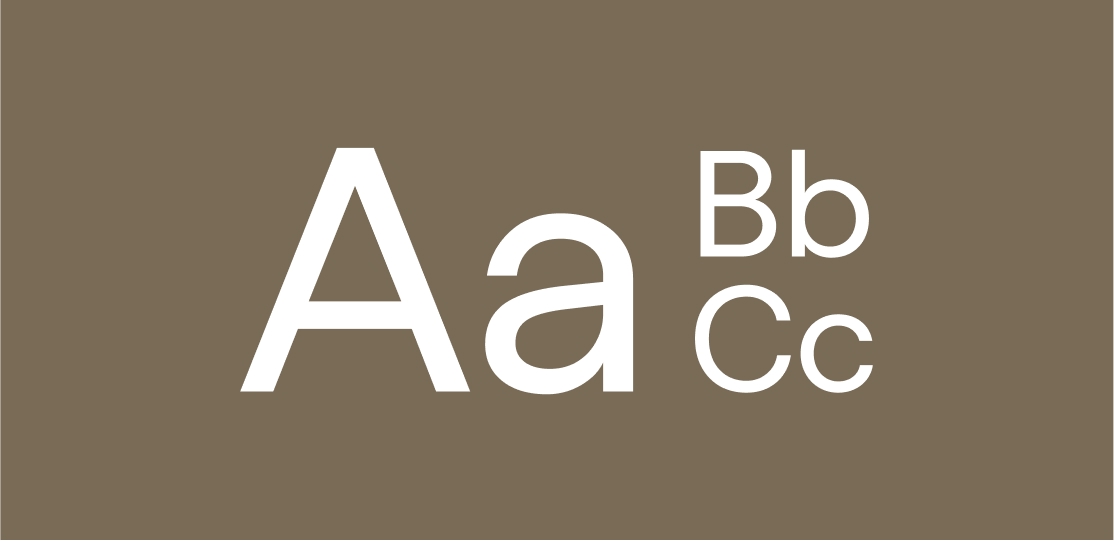 White uppercase and lowercase letters Aa Bb Cc on a brown background in a simple font.