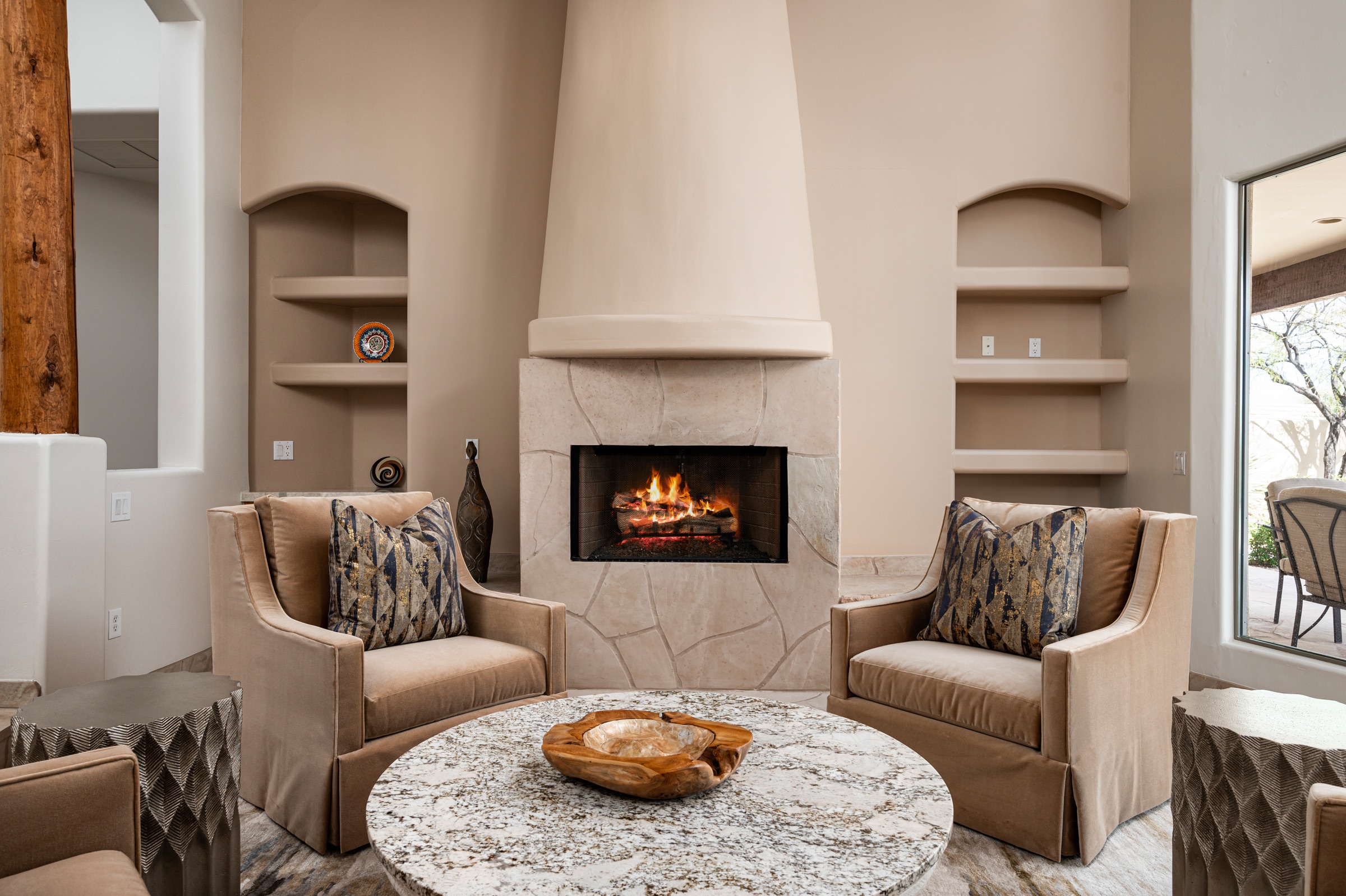 Southwest-style living room with kiva fireplace and plush seating