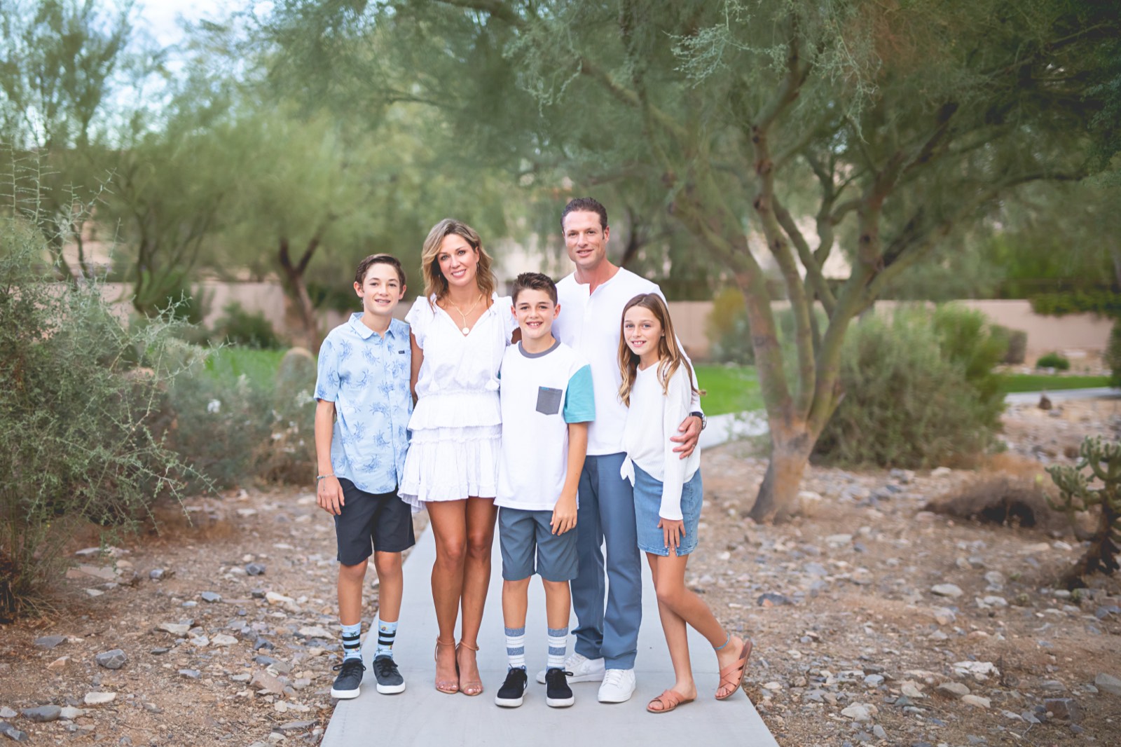 The Wolfe family enjoying the green spaces and paths of Windgate Ranch