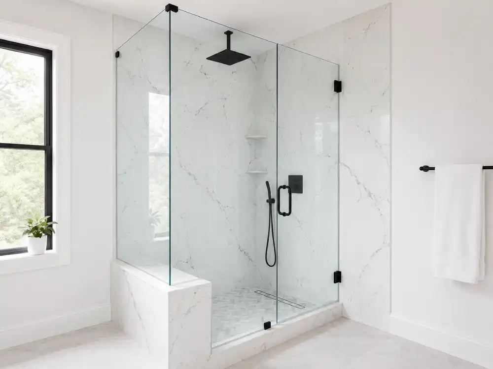 Walk-in glass shower with white marble-look walls and matte black rain showerhead and fixtures