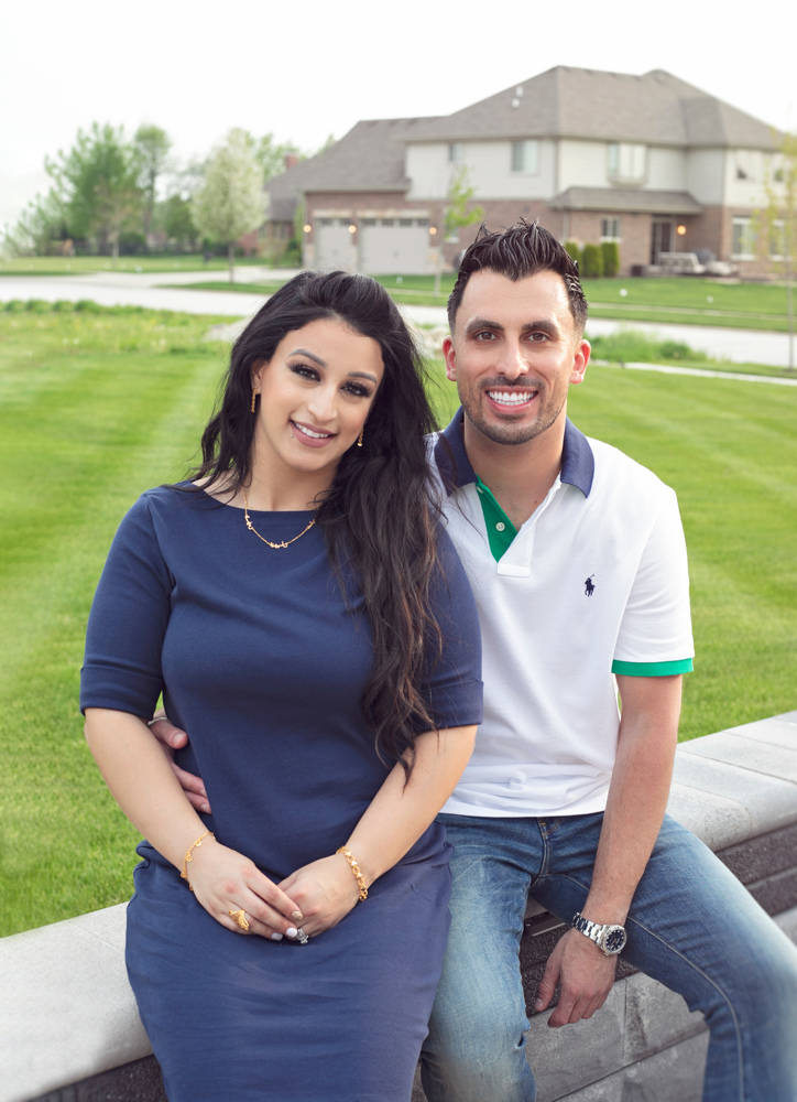 Firas Isa and his wife Sabreen Rihan posing together outdoors.