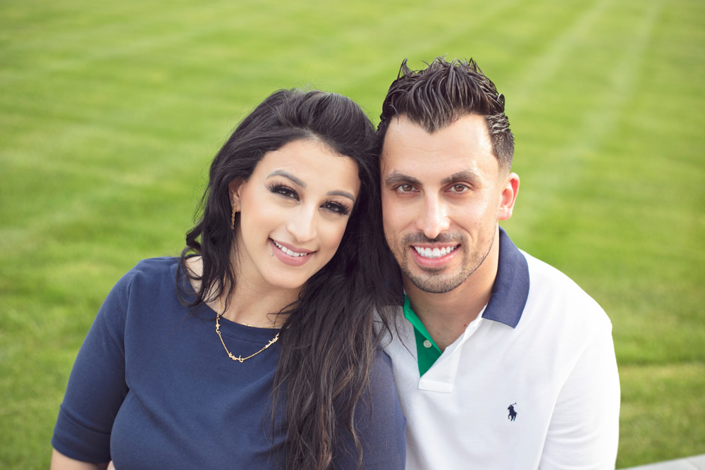 Firas Isa and his wife Sabreen Rihan posing together outdoors.