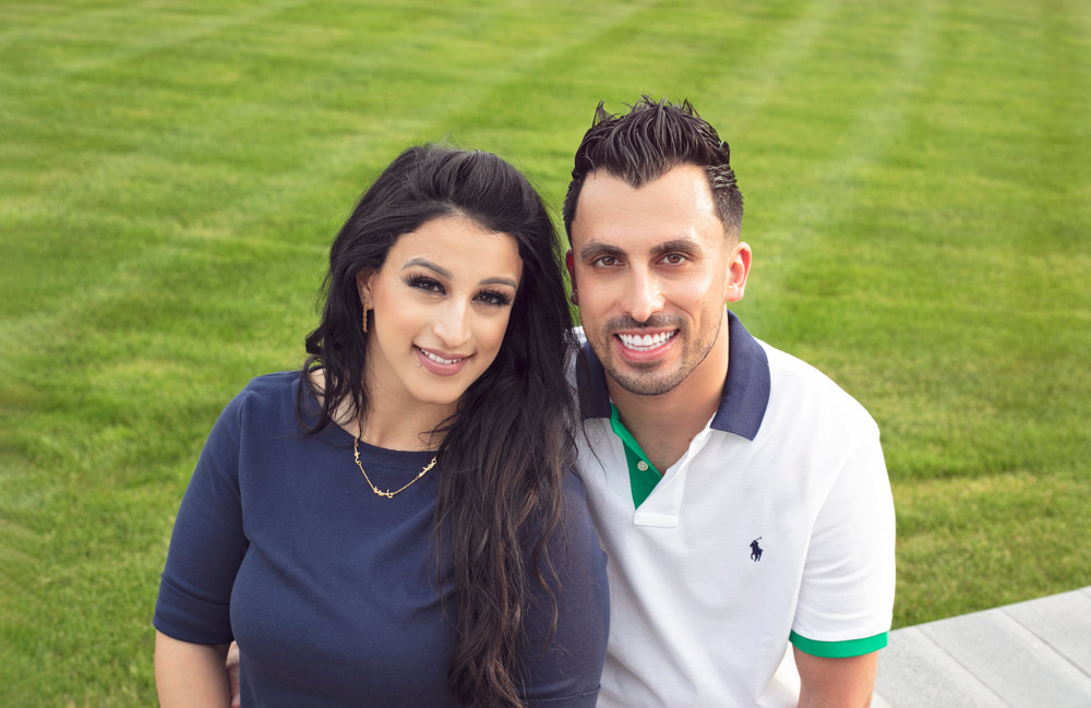 Firas Isa and his wife Sabreen Rihan posing together outdoors.