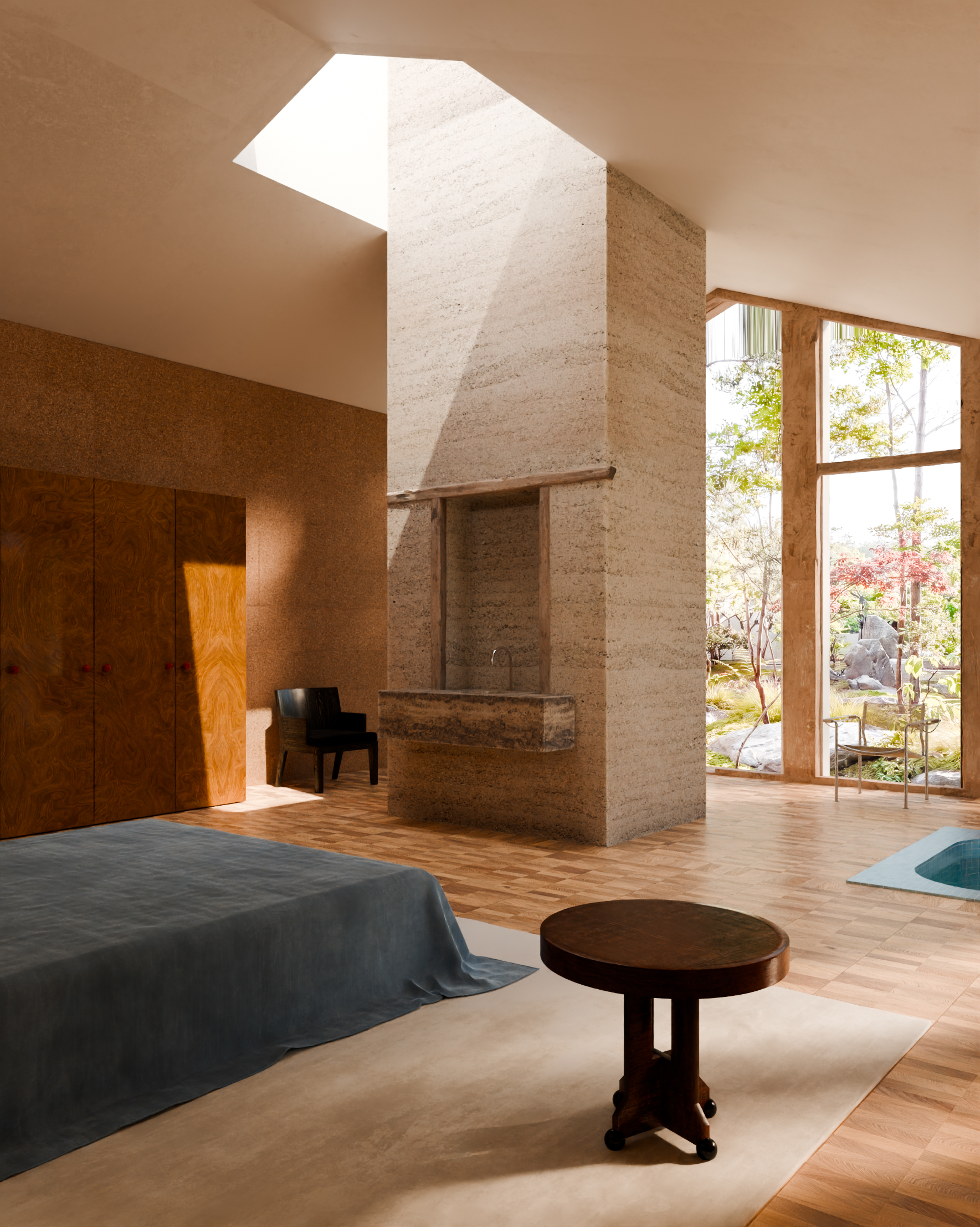 Modern bedroom with wooden floor, large windows, a bed with blue linen, and a central stone pillar with a sink.