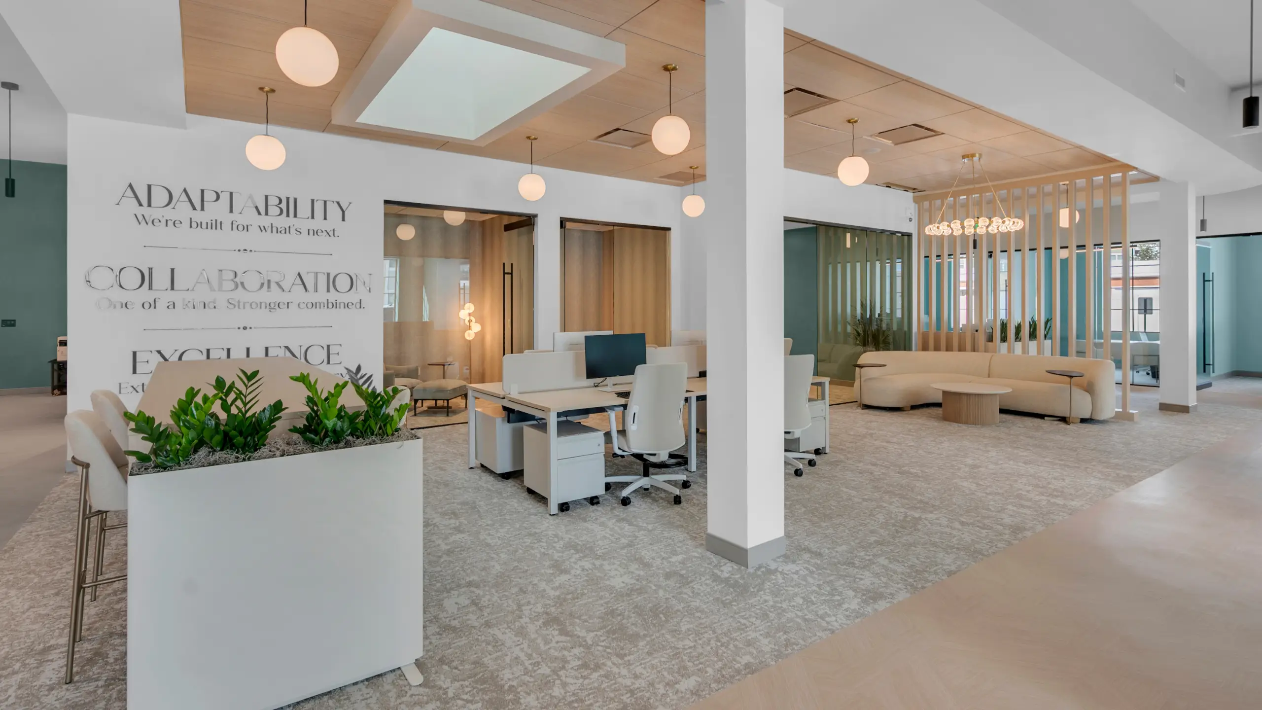 Modern Prestige Properties office interior featuring collaborative workspaces and meeting rooms.
