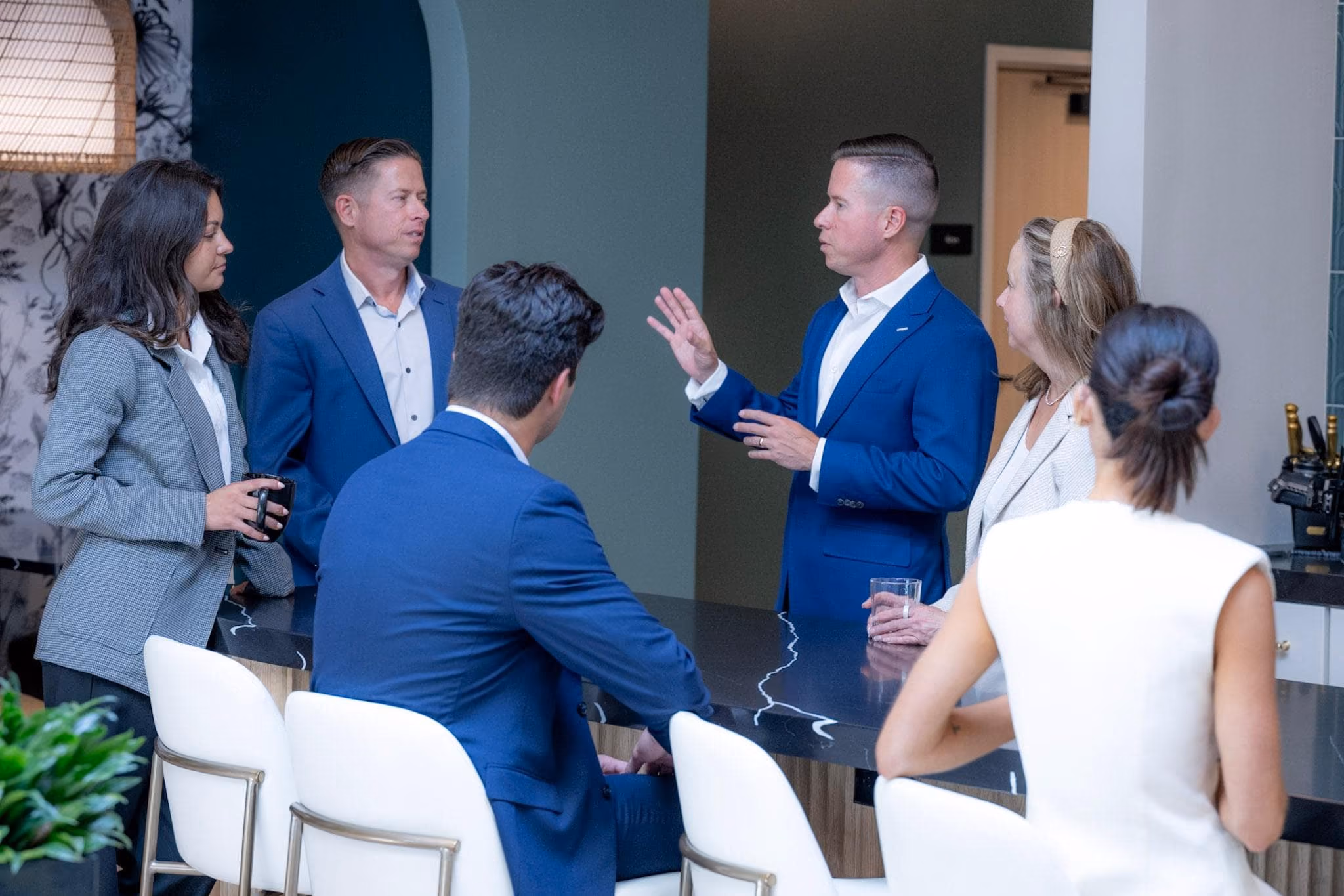 Mitch Painter presenting real estate investment strategy to team and clients at Prestige Properties