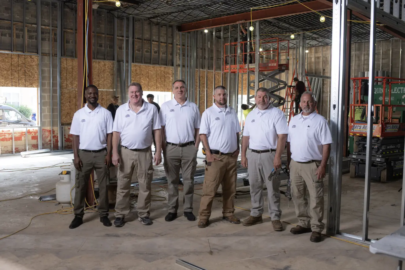 Prestige Properties construction team standing together at an active property development project.