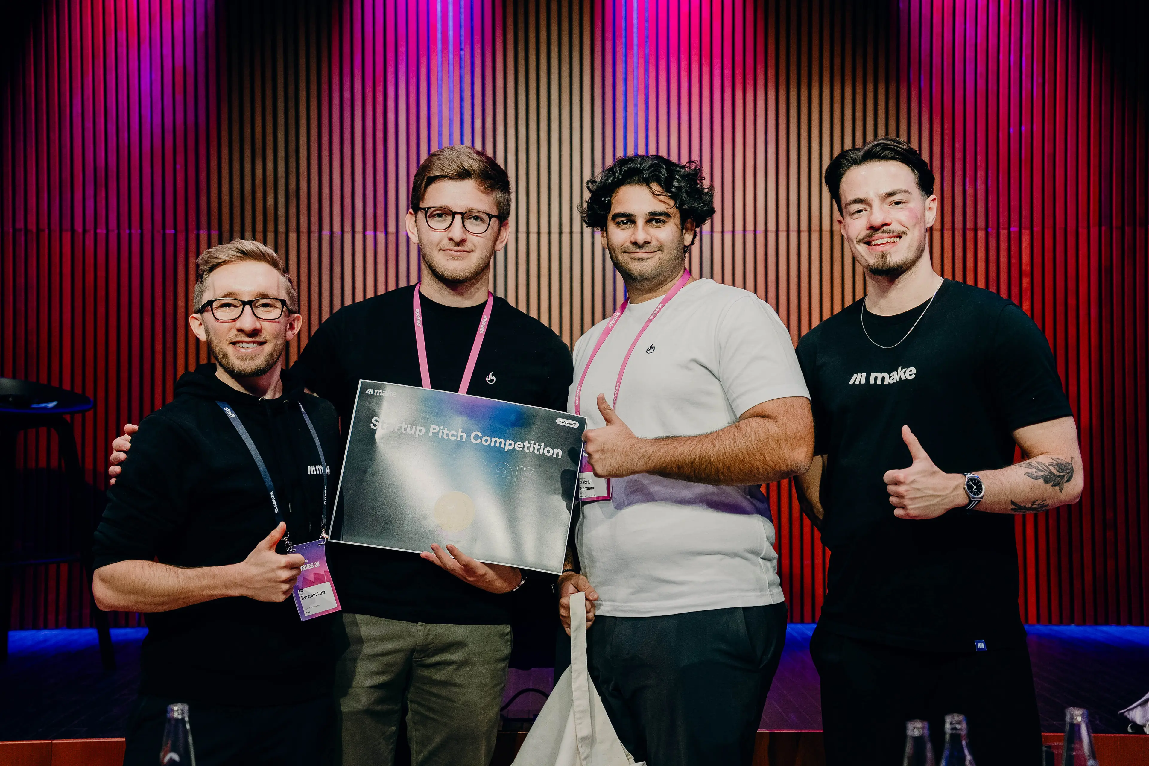 Winners holding a trophy at Make Waves '25