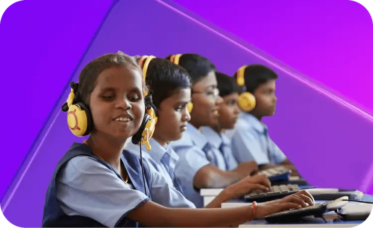 Children from the Indian Association for the Blind using computers with headphones