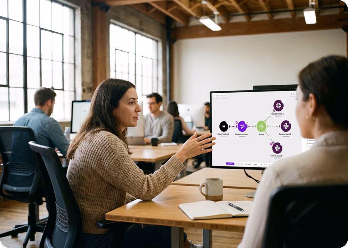 Students in a classroom looking at a Make scenario on screen