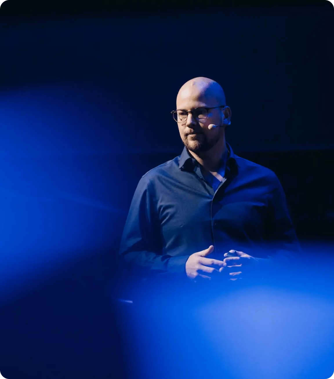 Speaker on stage at a Make event