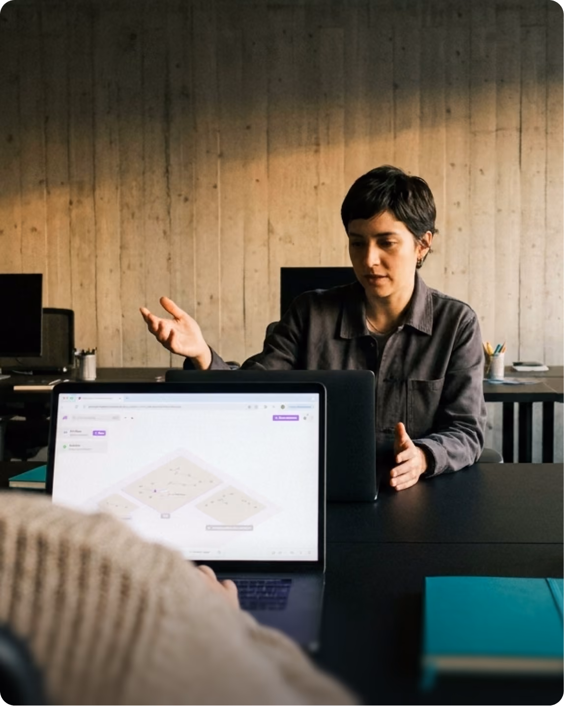 Woman presenting a dashboard in a meeting room