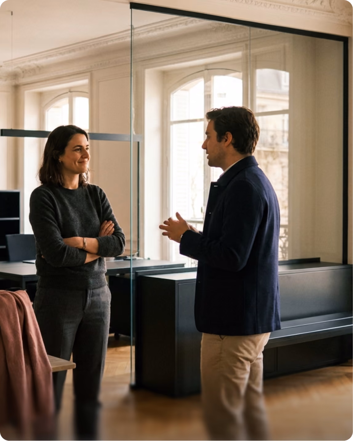 Two colleagues talking in an office