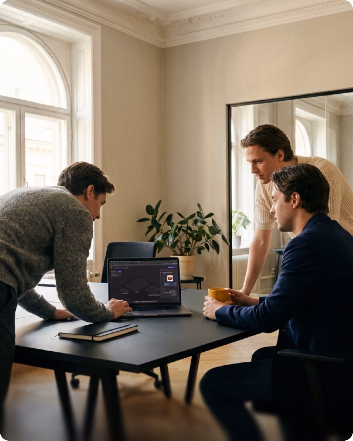 Colleagues building an integration together on a laptop