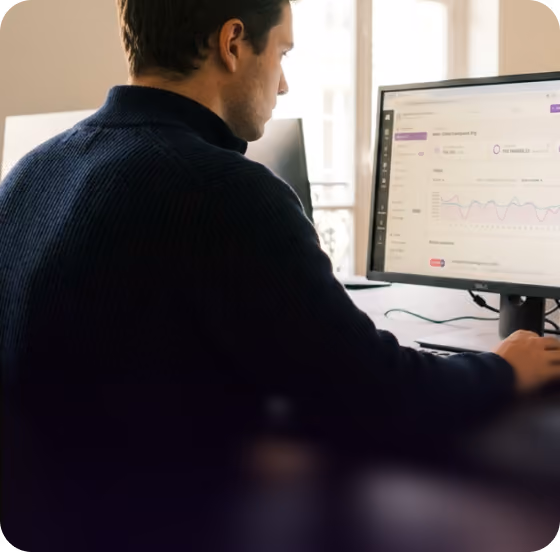 Person reviewing audit logs on a desktop monitor